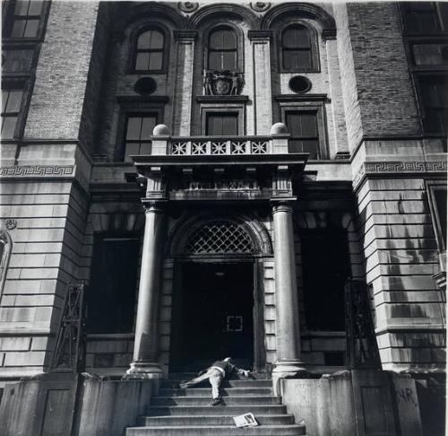 Older Man Lying on Stairs of Closed Police Station, NY, NY
