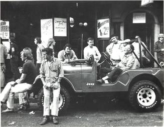 untitled (men in and around a jeep)