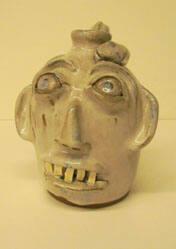 White face jug with snake