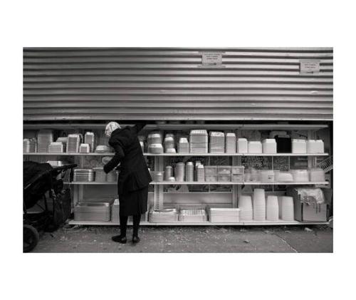 Woman Picking Food Container / Penn St, Brooklyn, NY
