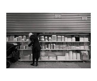 Woman Picking Food Container / Penn St, Brooklyn, NY
