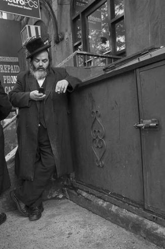 Man Looking at Cell Phone / Lee Ave, Brooklyn, NY