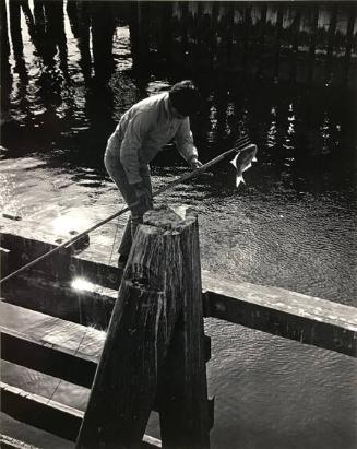 Spear fisherman on San Francisco docks