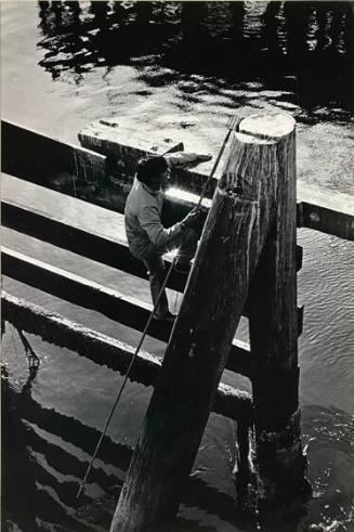 Spear fisherman on San Francisco docks