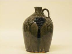 Jug with grapes