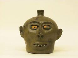 Rock-toothed face jug