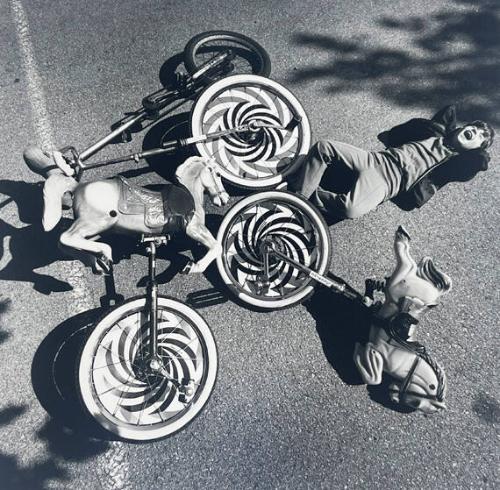 Boy and Monocycles, NY
