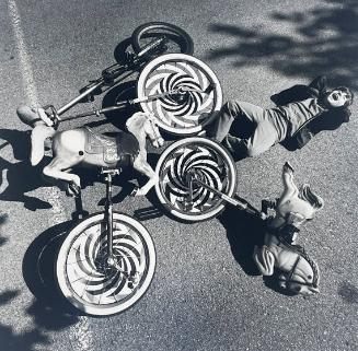 Boy and Monocycles, NY
