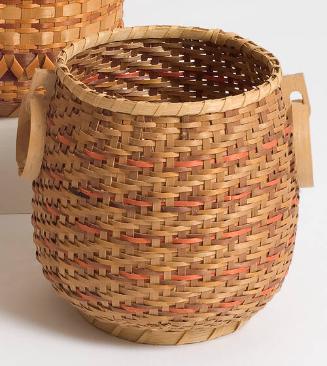 Basket with carved loop handles