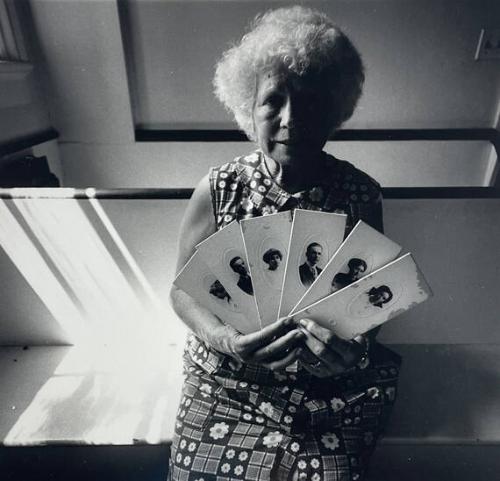 Woman with Old Cabinet Cards, NY
