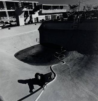 A Young Boy Climbs out of an Empty Swimming Pool, Hyanis MA
