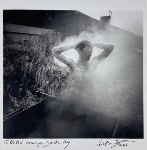 Tattooed Man in Smoke, NY
