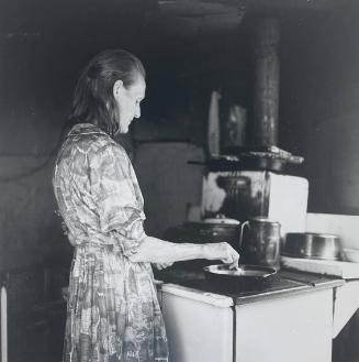 Mrs.Boone Working at Her Stove, Boone, WC