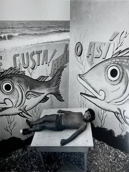 Boy on Table at Fish Restaurant, Caracas, Ven
