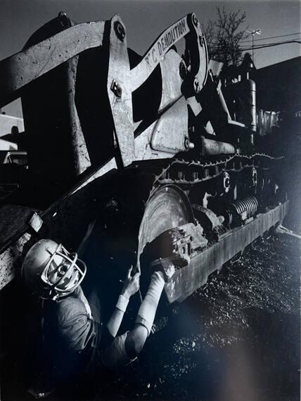 Teen in Football Helmet Under Tractor, Brooklyn, NY
