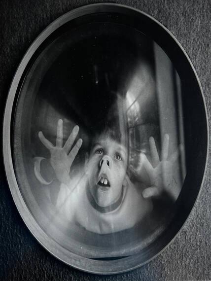 Boy Looking Through Window, Boston, Mass
