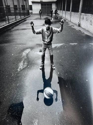 Teen with Ball in Puddle, NY
