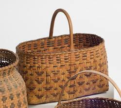 Basket with arch handle