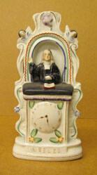 John Wesley in the pulpit with black robe