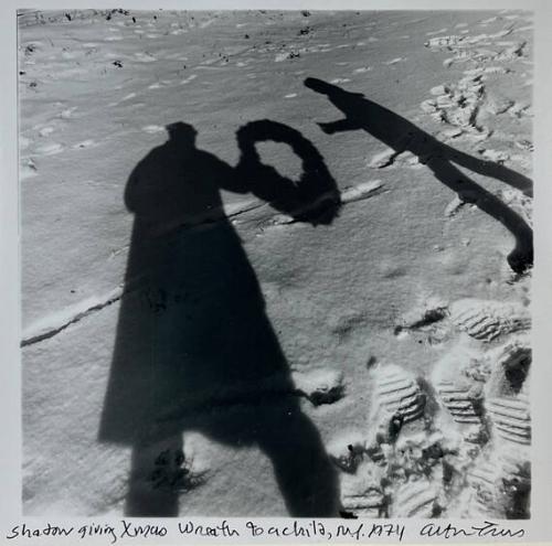 Shadow Giving X-mas Wreath to a Child, NY
