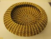 Gullah bowl shaped coil basket with cantilevered inward rim