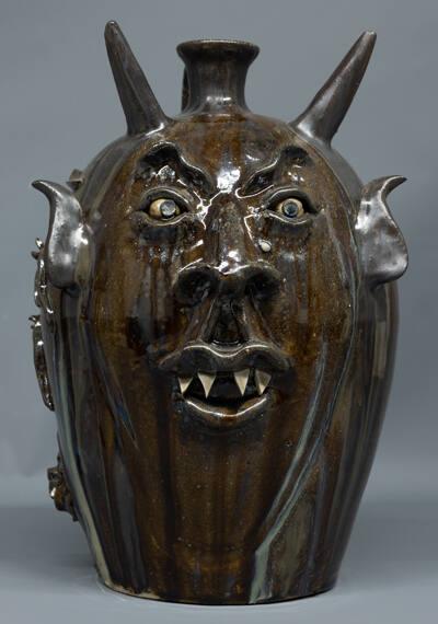 Two-Sided Devil Jug with the "Evolution of Rhodes Clay to a Devil Jug"