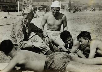 Gunners from England (sitting on beach)
