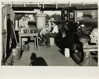 Oklahoma (mother and child and two men in parking lot)
