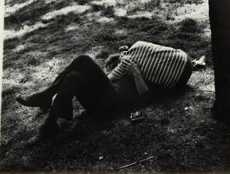 untitled (couple embracing on the grass)