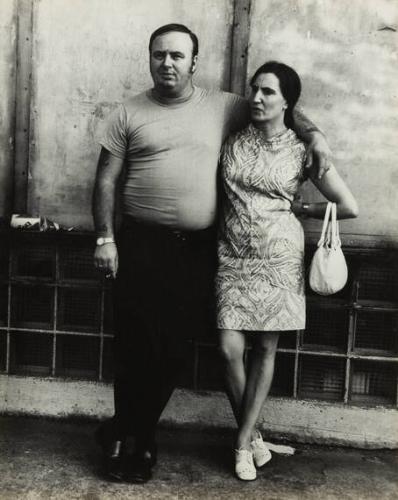 untitled (couple, man with arm around woman holding purse)