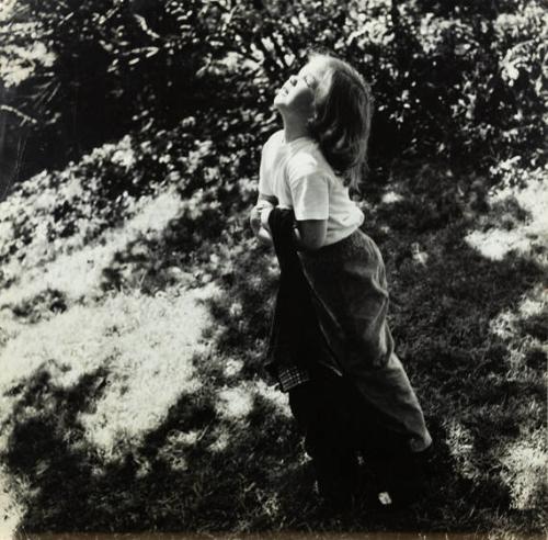 untitled (girl in park holding jacket)