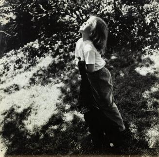 untitled (girl in park holding jacket)