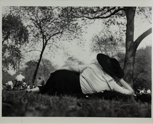 Central Park (woman with large black hat resting on the grass)