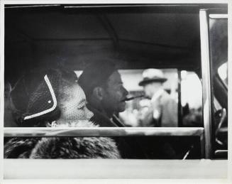 Lower East Side (man and woman in a car, veil, hat)