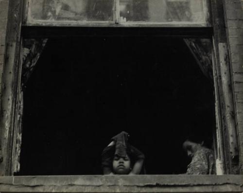 New York (child and woman inside a window)