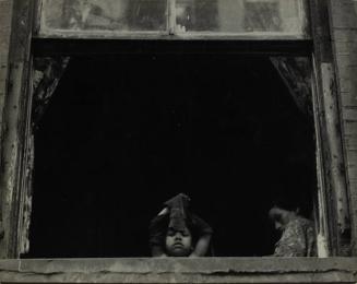 New York (child and woman inside a window)