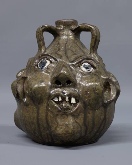 Three-sided face jug