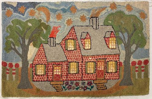 Hooked rug with red brick house