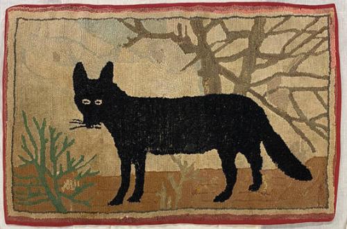 Hooked rug with black fox