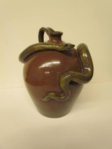Brown jug with snake