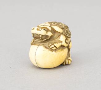 Japanese Ivory Netsuke Modeled as a Foo Dog Surmounting Ball