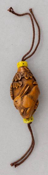Japanese Ivory Netsuke Modeled as a Round Form with Pierced Crysanthemum Design