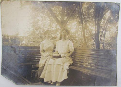 Untitled (Two Women Sitting On Deck)