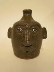 Face jug with mustache