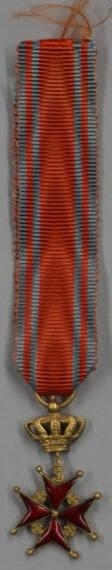 Three miniature insignia of non-Russian orders suspended on ribbons with their respective colors