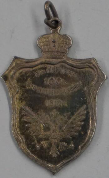Medal in the form of a heraldic shield surmounted by an imperial crown celebrating a centennial